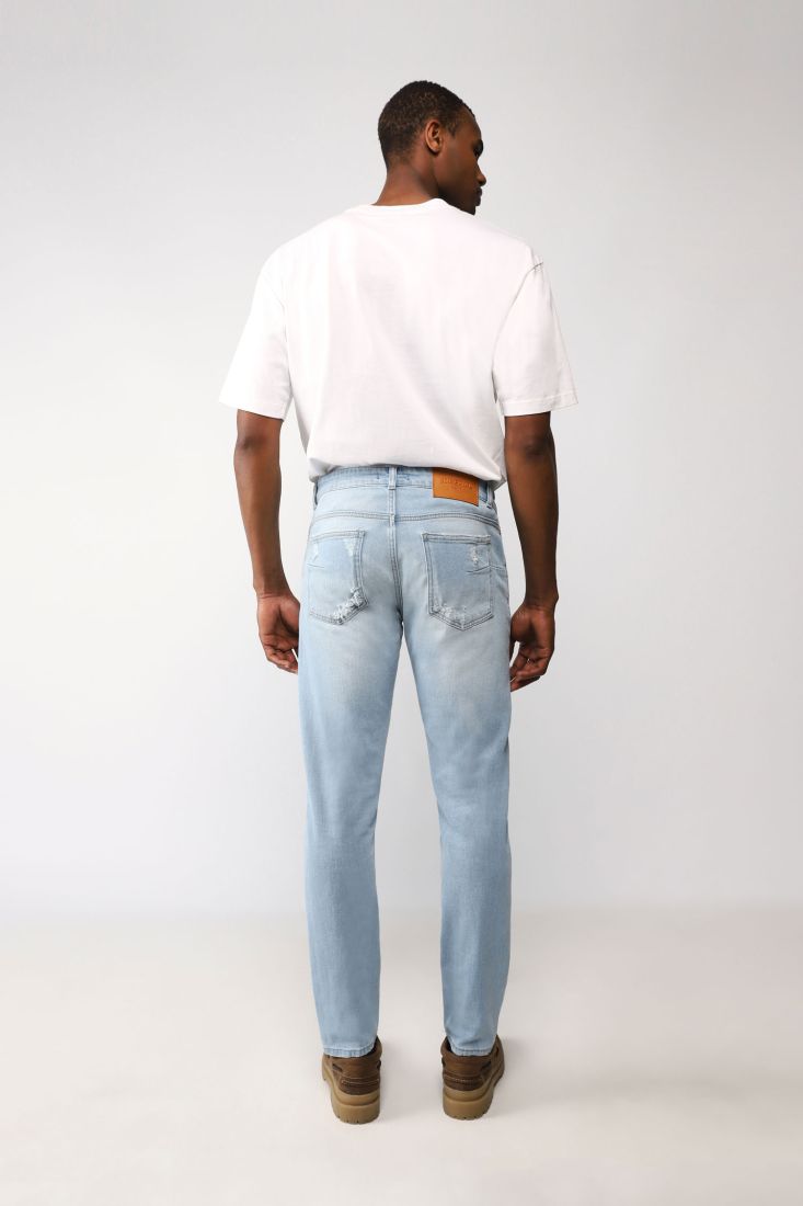 Jeans slim cropped effetto délavé con abrasioni
