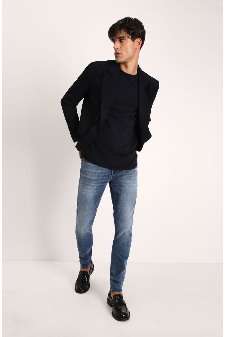 Jeans slim-fit effetto délavé con cinque tasche