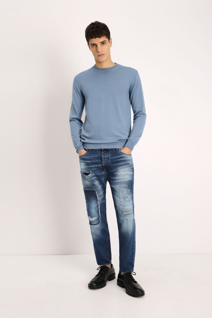 Jeans slim-fit effetto délavé con strappi