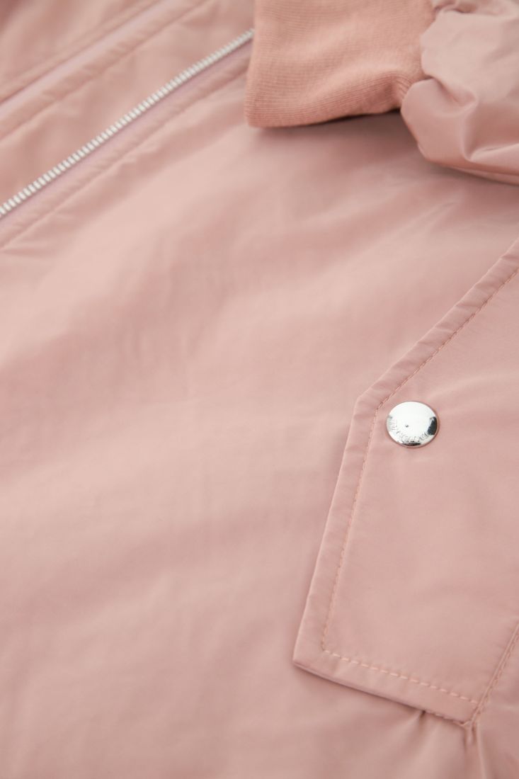 Piumino oversize con orli a contrasto e zip